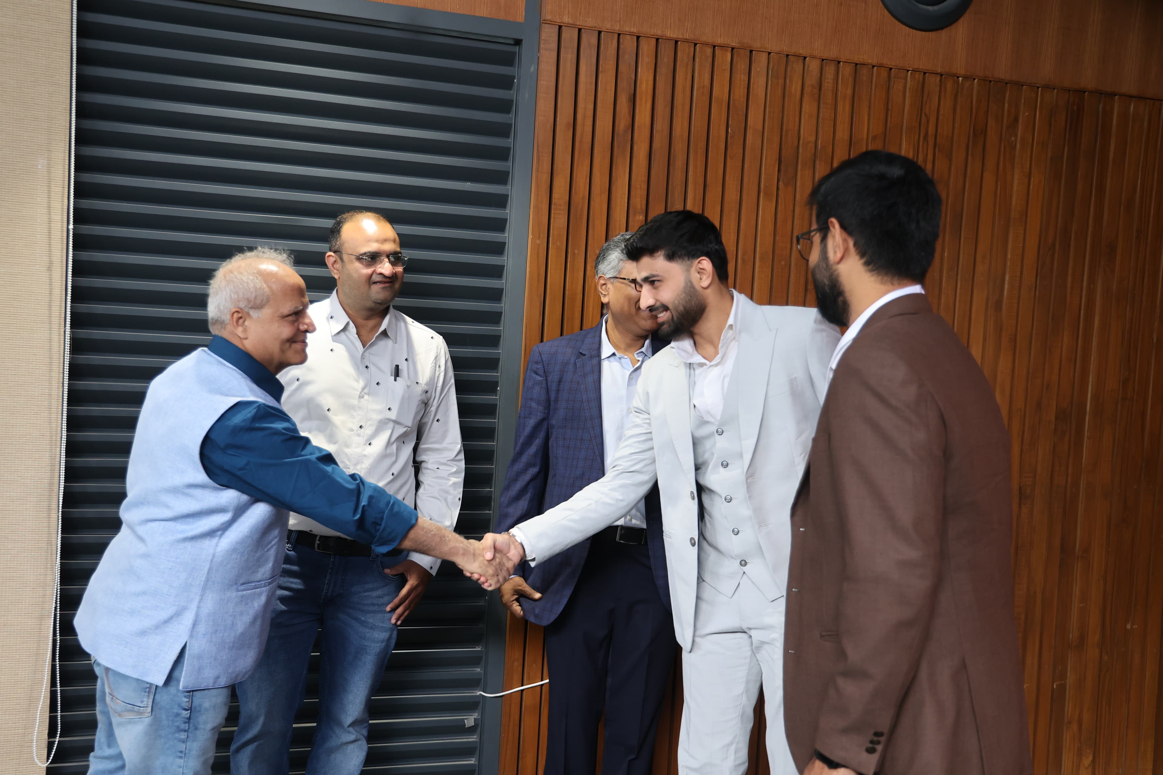 Mentor speaking with a founder team during office hours